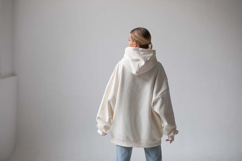 beautiful-blonde-woman-white-hoodie-blue-jeans-posing-white-background.jpg