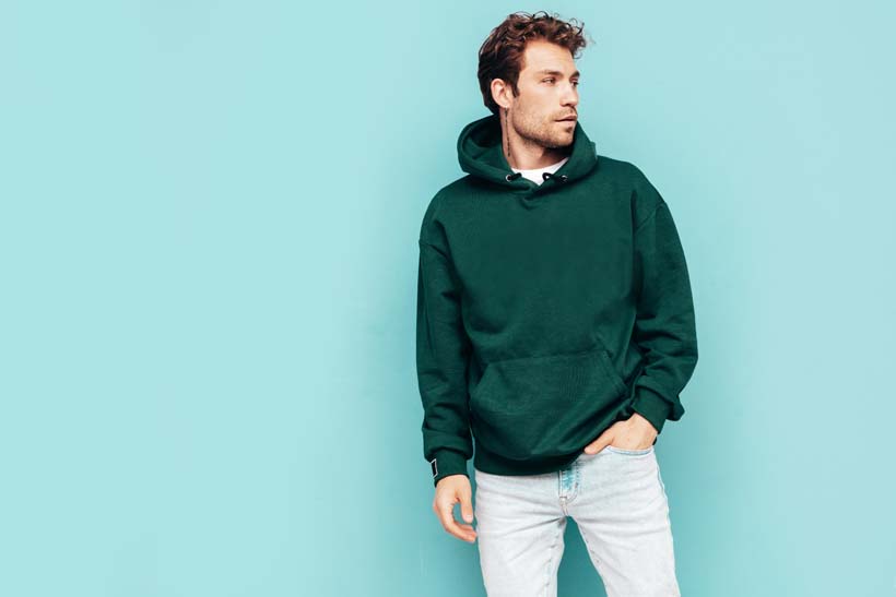 handsome-confident-hipster-modelsexy-unshaven-man-dressed-summer-stylish-green-hoodie-jeans-clothes-fashion-male-with-curly-hairstyle-posing-studio-isolated-blue.jpg